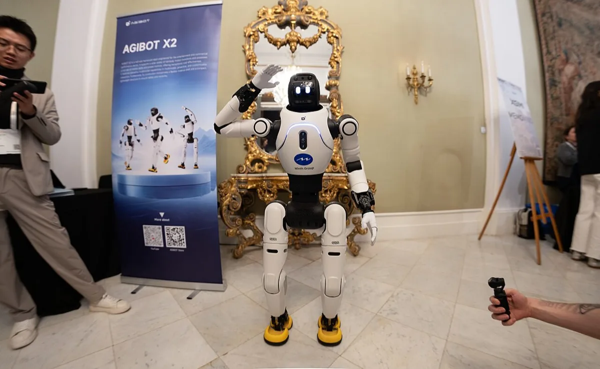 AgiBot X2 humanoid robot demonstrated indoors next to its product banner