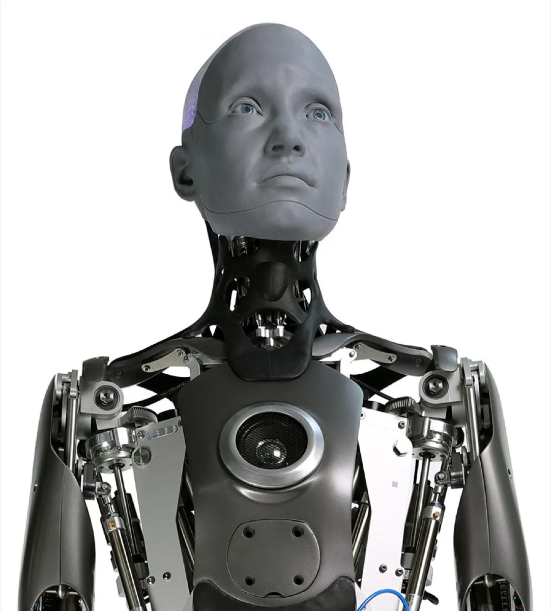 Close-up of the Engineered Arts Ameca humanoid robot's expressive head and upper torso, showing exposed mechanical neck and shoulder joints