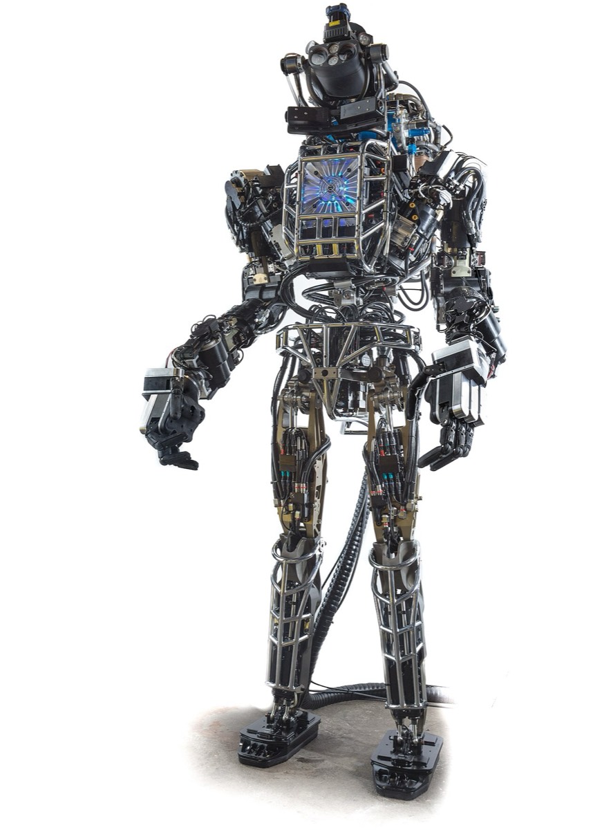 Front view of the hydraulic Boston Dynamics Atlas robot, with exposed hoses and cabling