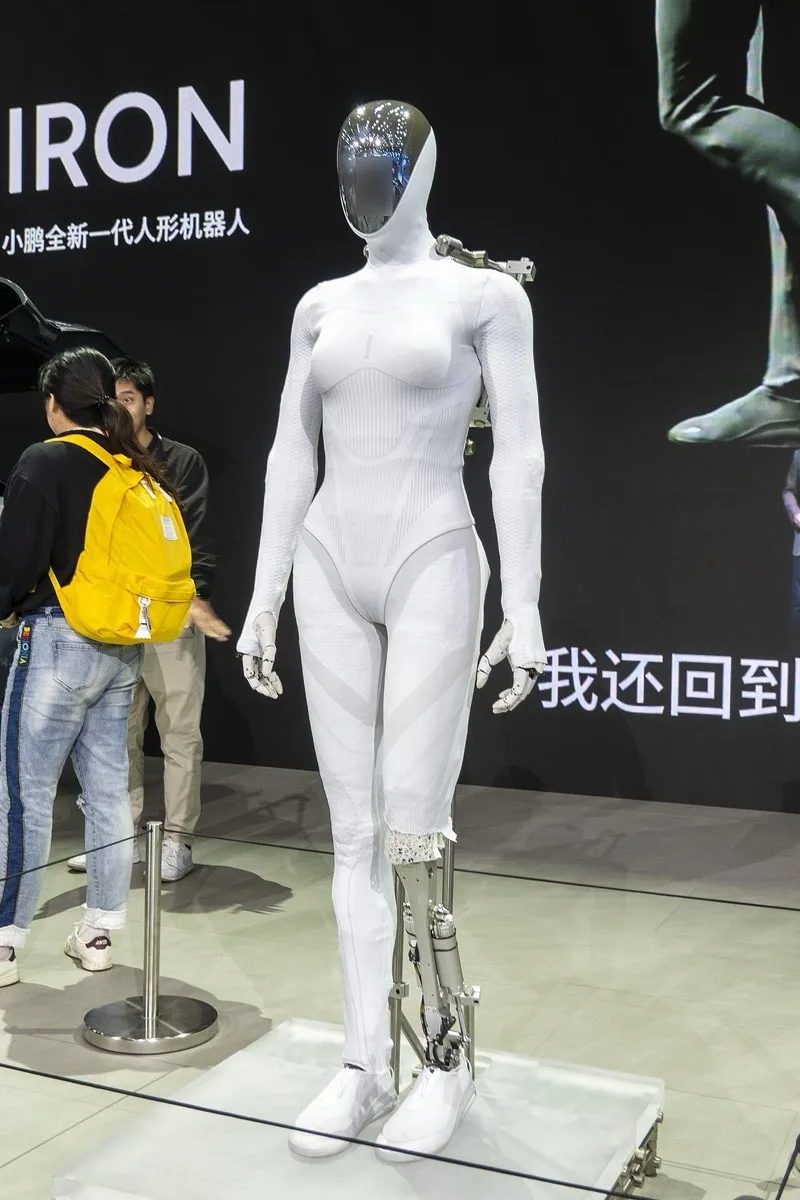 XPeng Iron humanoid robot on display at Auto Guangzhou 2025, wearing a white bodysuit exterior