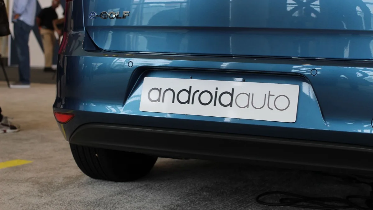 Volkswagen e-Golf with an Android Auto badge on the rear, used to demonstrate Google's in-car platform