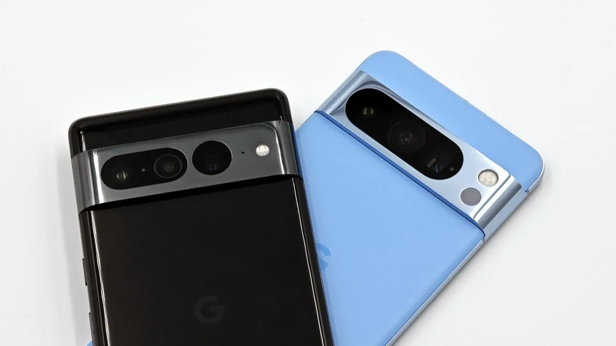 Google Pixel 7 Pro and Pixel 8 Pro smartphones stacked together, showing the Google 'G' logo on their backs
