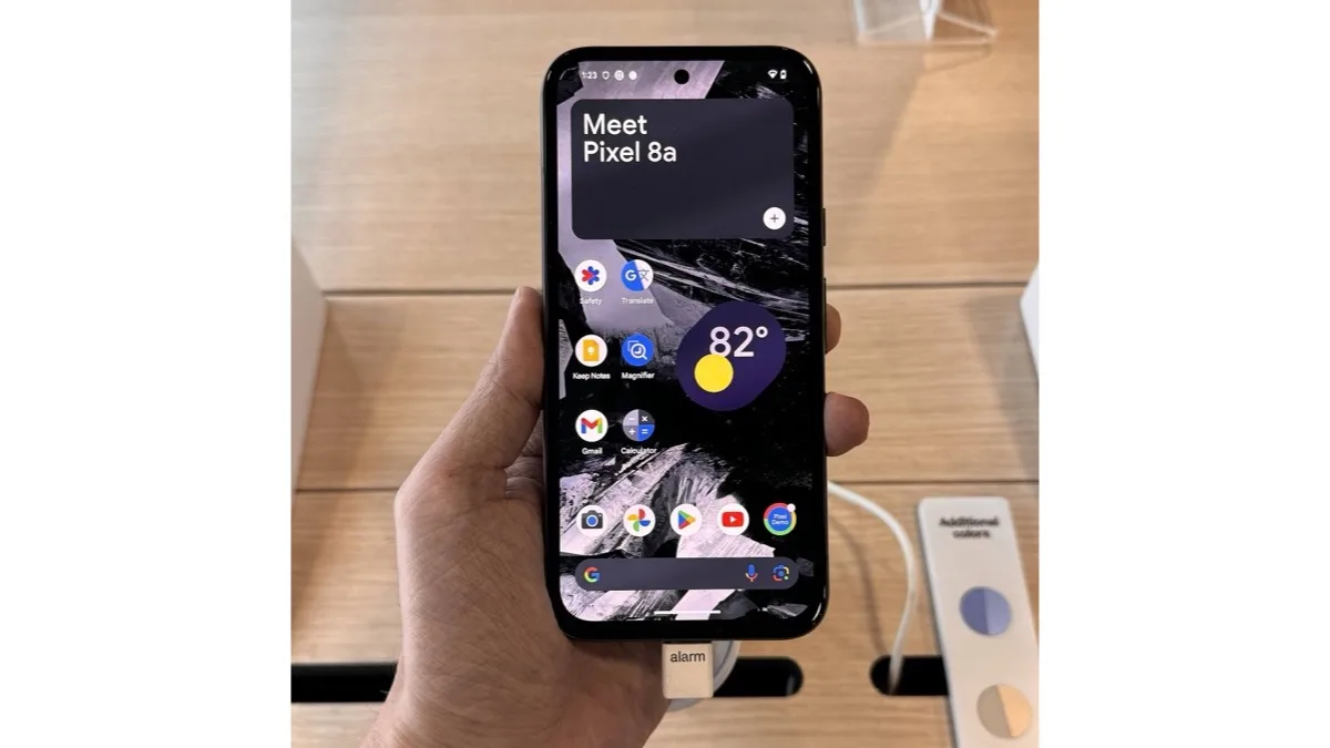 A hand holding a Pixel phone showing its Android home screen, used to illustrate Google's on-device Gemini AI features