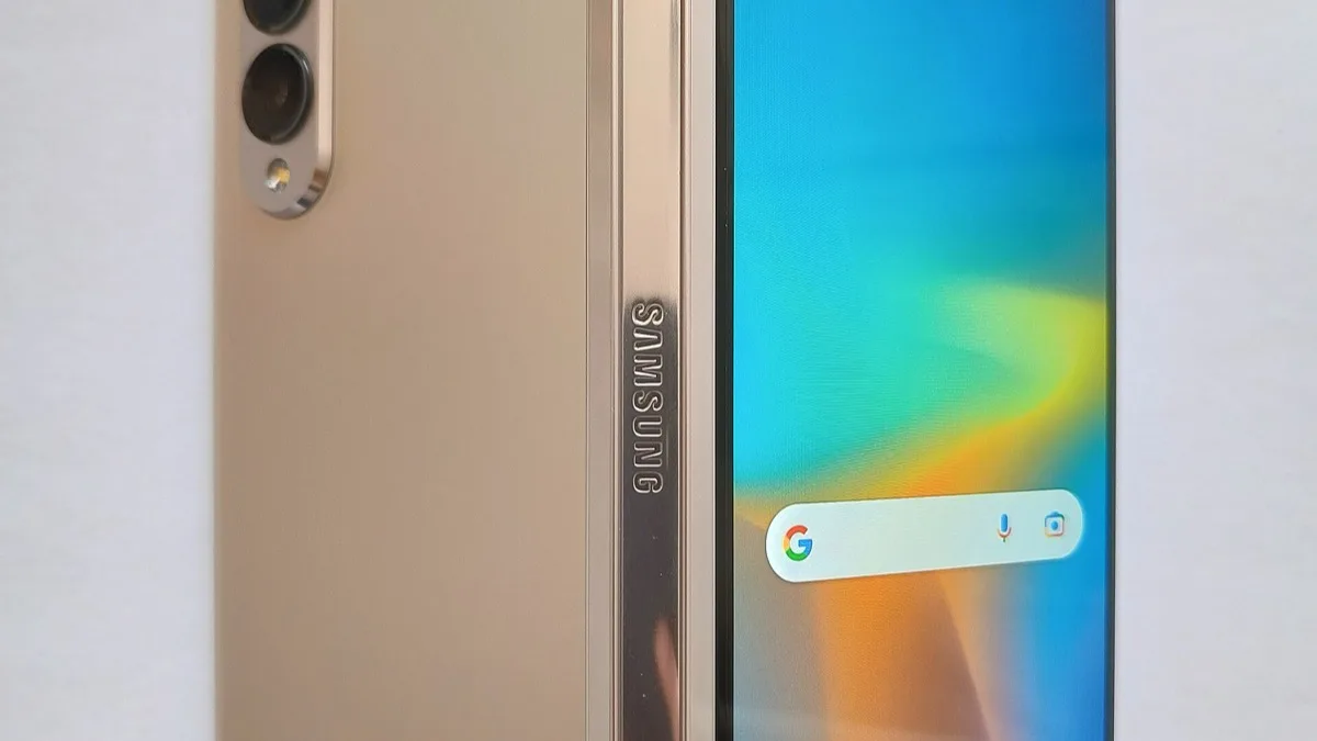 Close-up of a Samsung Galaxy Z Fold's hinge and cover screen showing the Samsung logo and a Google search bar