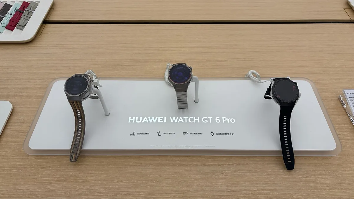Three Huawei Watch GT 6 Pro smartwatches on a retail display stand, the model the GT 7 series replaces