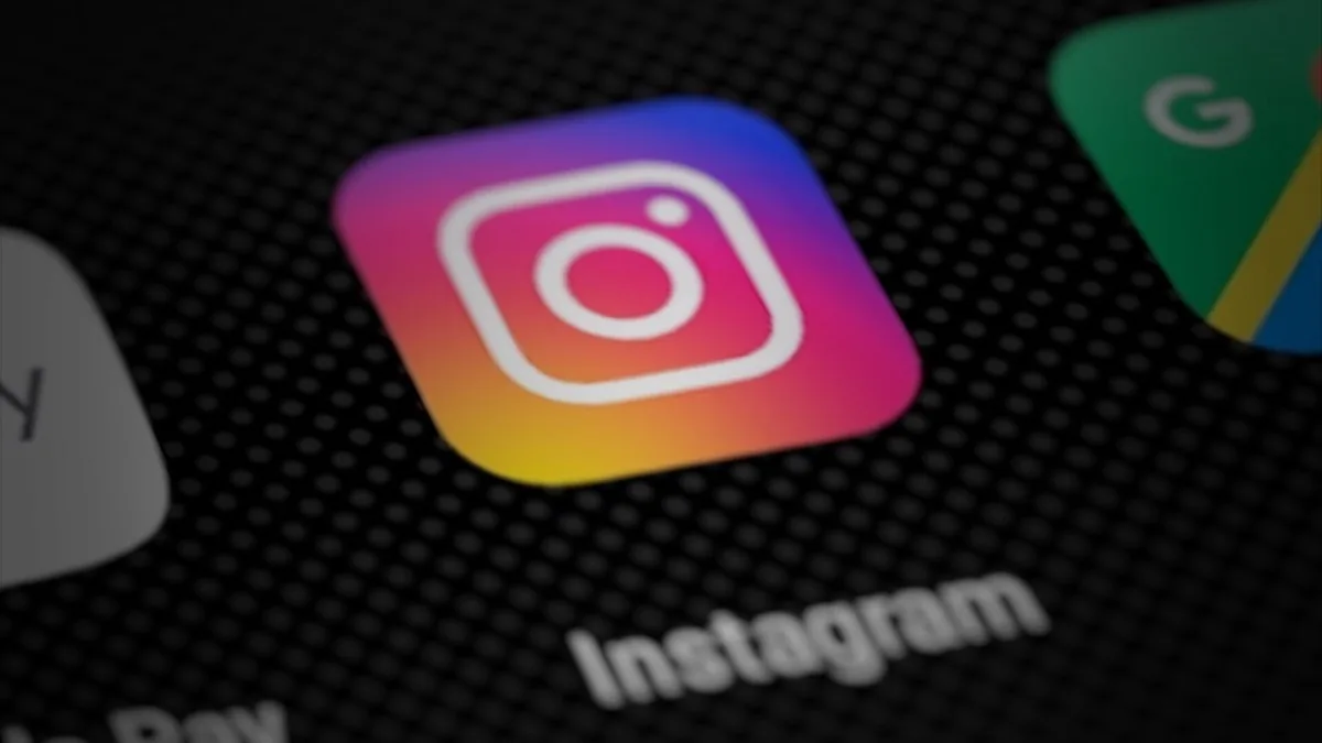 Close-up of the Instagram app icon on a smartphone home screen, next to Google apps
