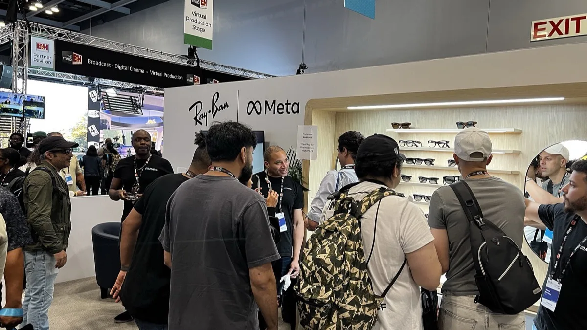 Ray-Ban Meta smart glasses on display at a trade show booth branded with the Ray-Ban and Meta logos