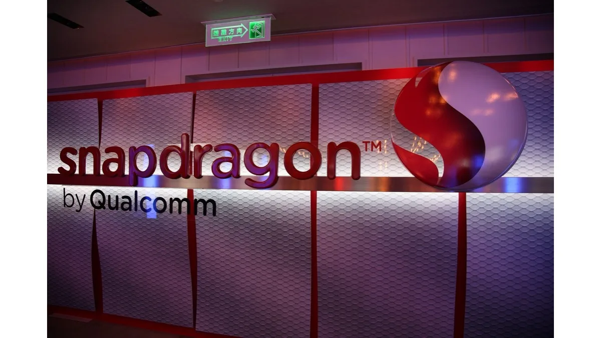Illuminated Snapdragon by Qualcomm logo display at a trade show