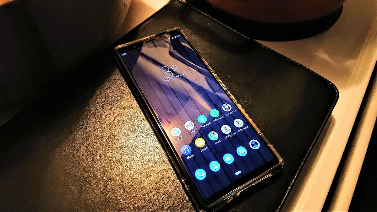 A Sony Xperia phone lying screen-up showing its Android home screen, representing the Xperia 10 series design