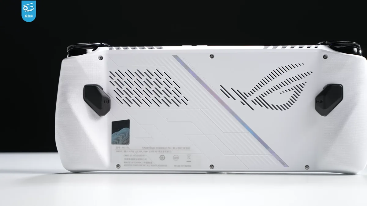 The underside of a white gaming handheld PC, showing its cooling vents and grip contours