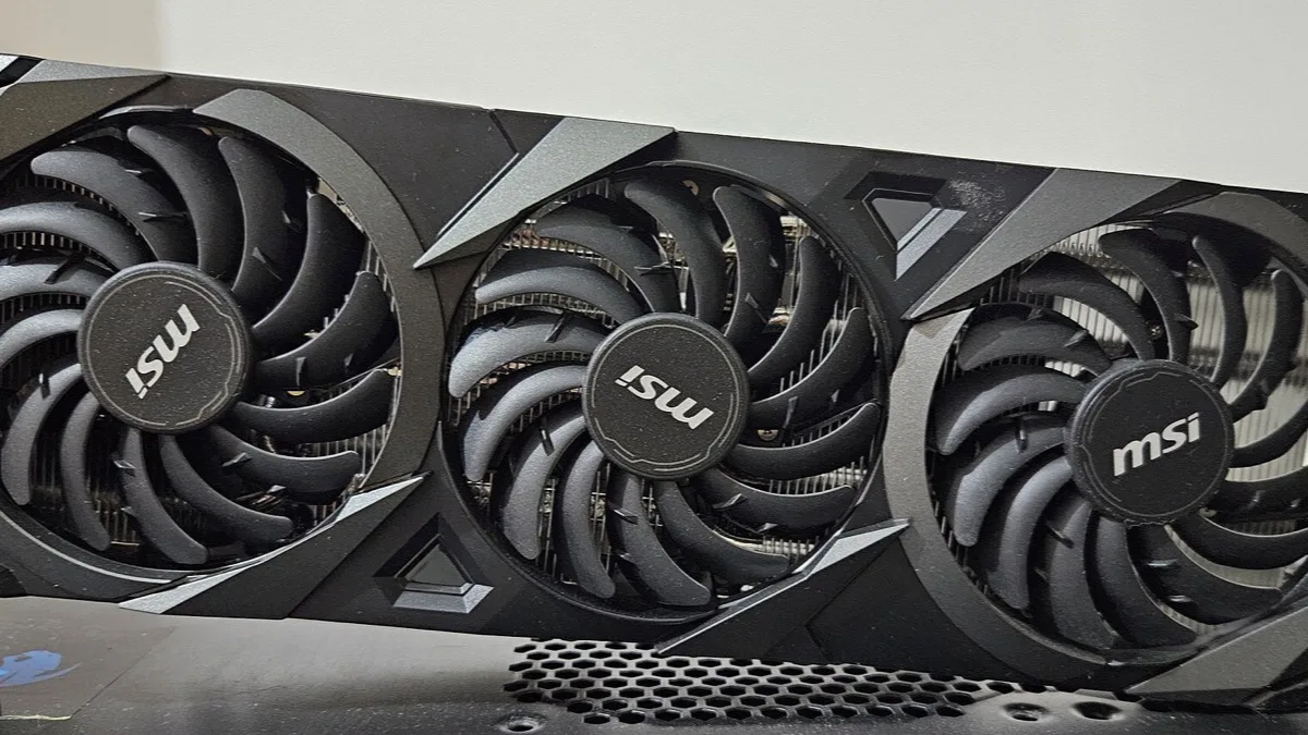 MSI GeForce RTX 3070 VENTUS 3X OC graphics card showing its three cooling fans inside a desktop PC