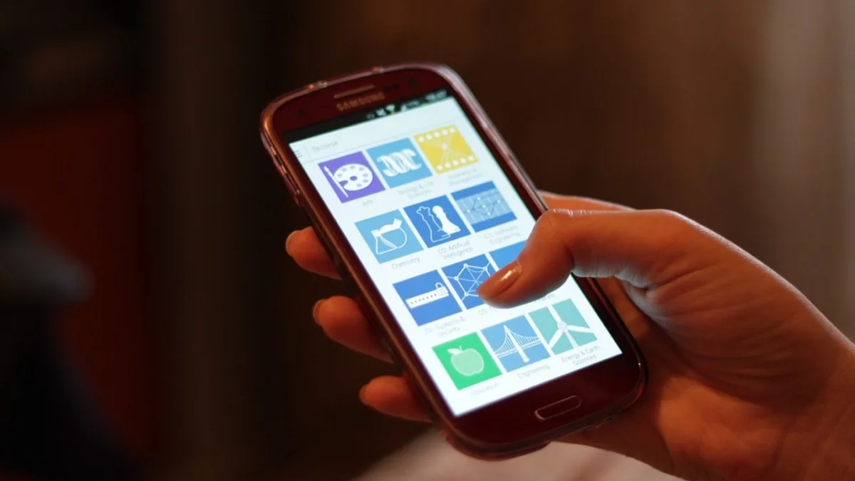 A person tapping through an app on an Android phone held in one hand