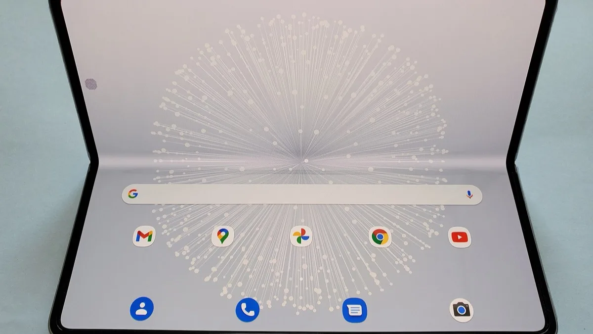 A book-style foldable phone opened flat, showing the full inner display and its four corners