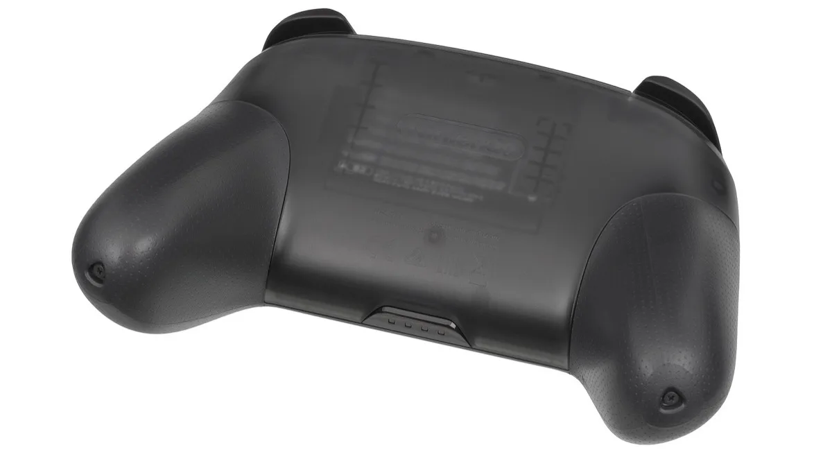 The rear of a black Nintendo Switch Pro Controller resting on a plain white background