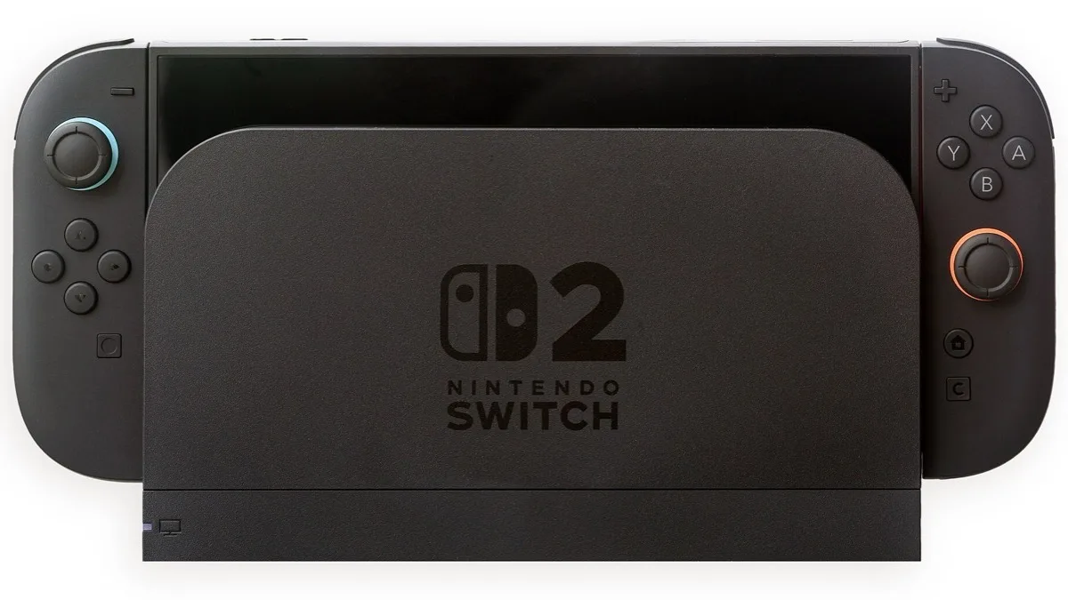 A Nintendo Switch 2 console sitting in its black dock with grey Joy-Con 2 controllers attached on either side