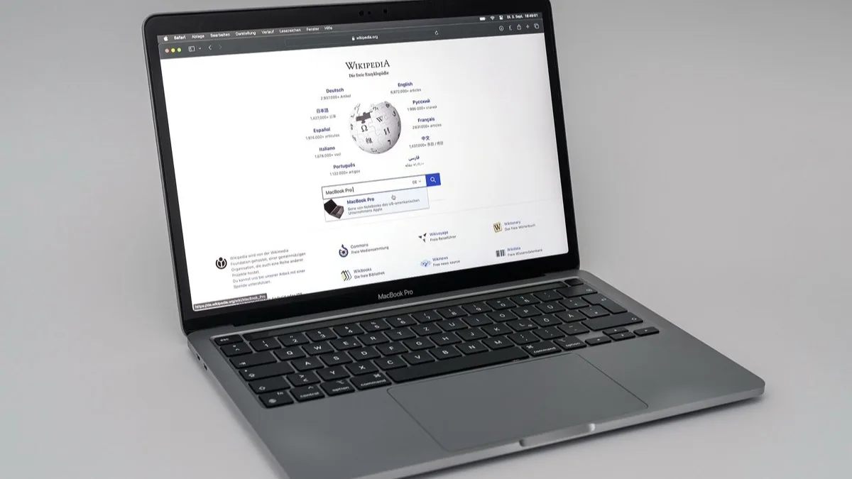 A MacBook Pro open on a desk, the type of Apple Silicon laptop that runs Perplexity's new local AI models