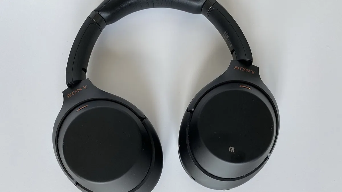 Sony 1000X-series over-ear noise-cancelling headphones in black, shown flat with the earcups rotated
