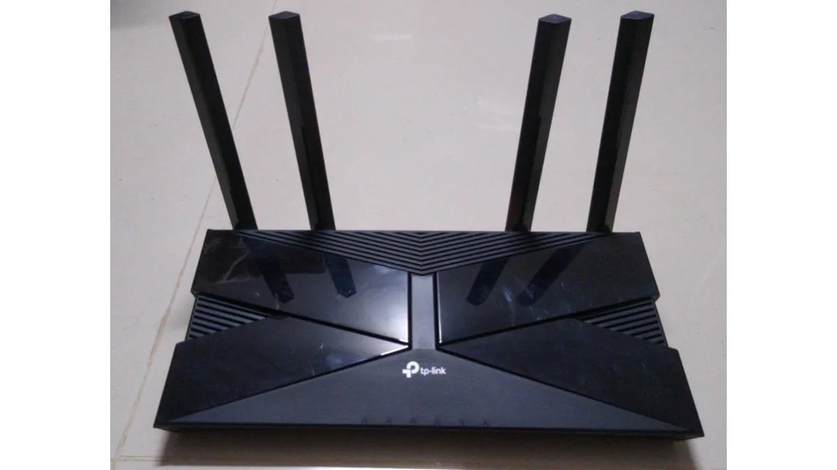 A TP-Link router with four upright antennas, representative of the company's home networking hardware