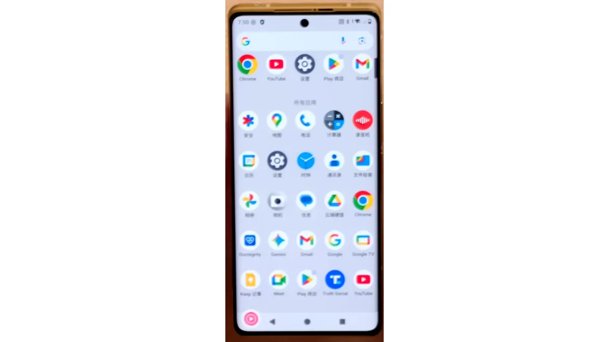 The gold-bodied T1 Trump Mobile phone showing its Android app drawer with a Truth Social icon