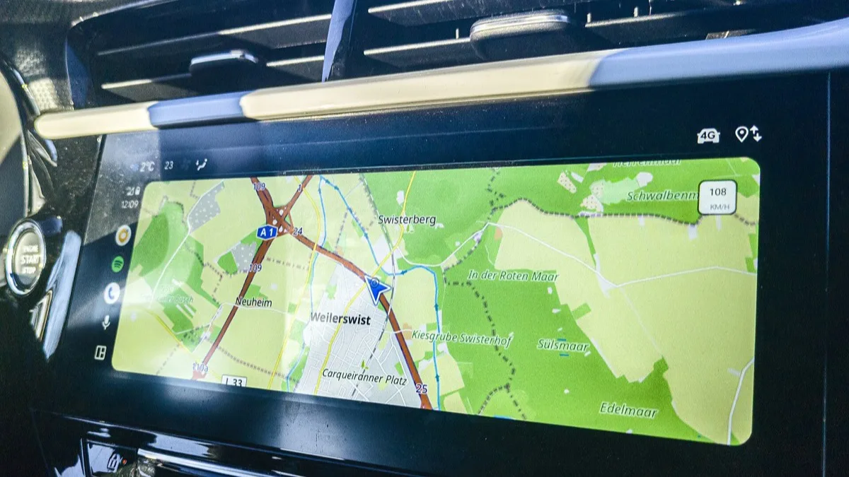 A full-screen navigation map on a car infotainment display with no journey information panel visible