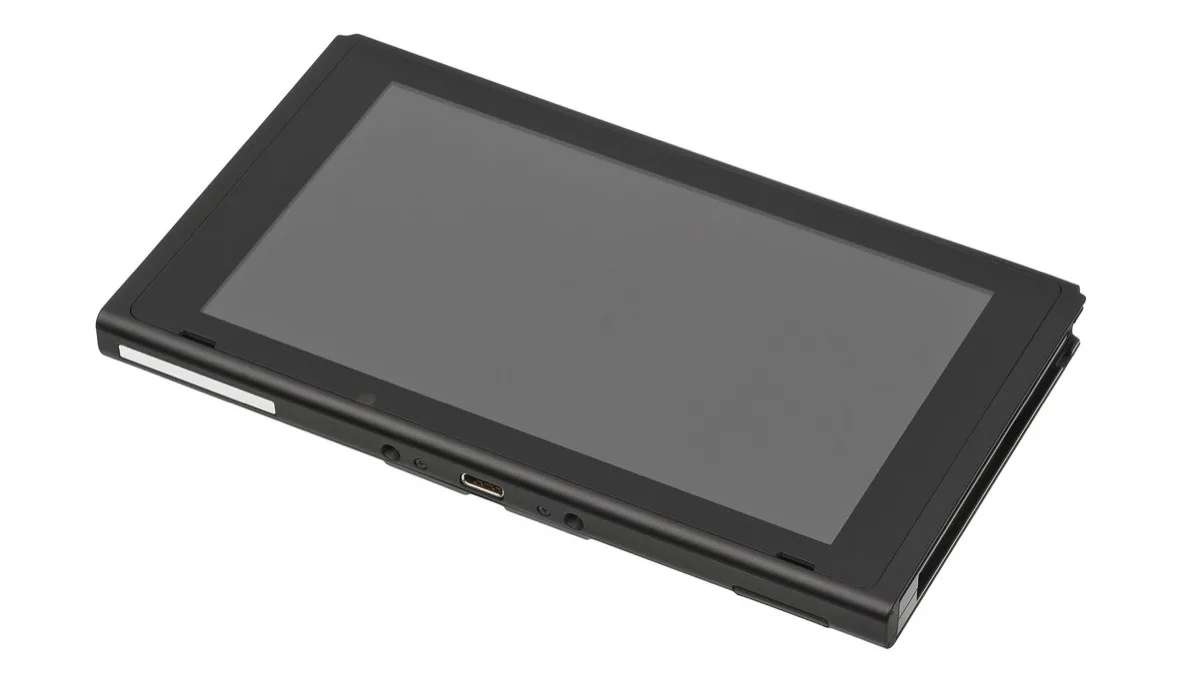 An original Nintendo Switch console body lying screen-up on a plain white background with its Joy-Con controllers detached