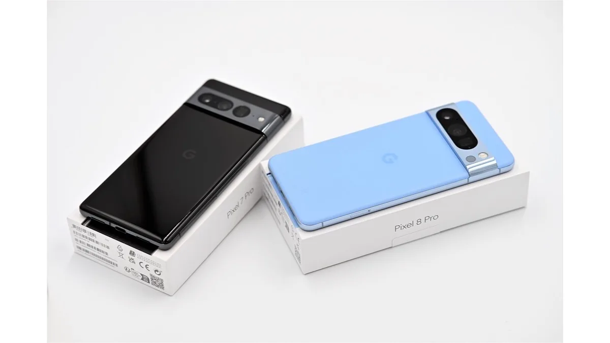 Google Pixel 7 Pro in black and Pixel 8 Pro in blue lying on their retail boxes