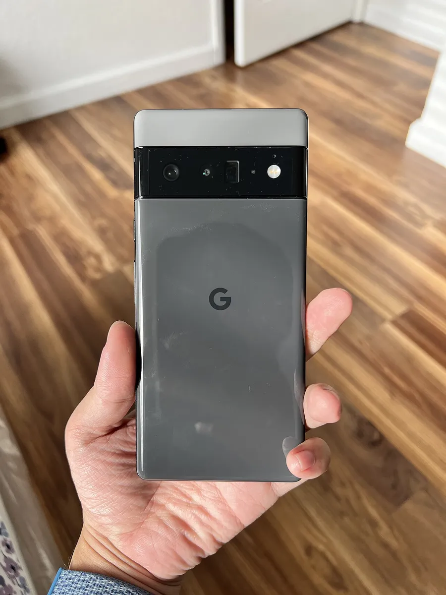 Back of a Google Pixel 6 Pro showing the black camera bar with its lenses and flash